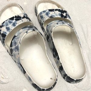some blue and white tiedied sandals